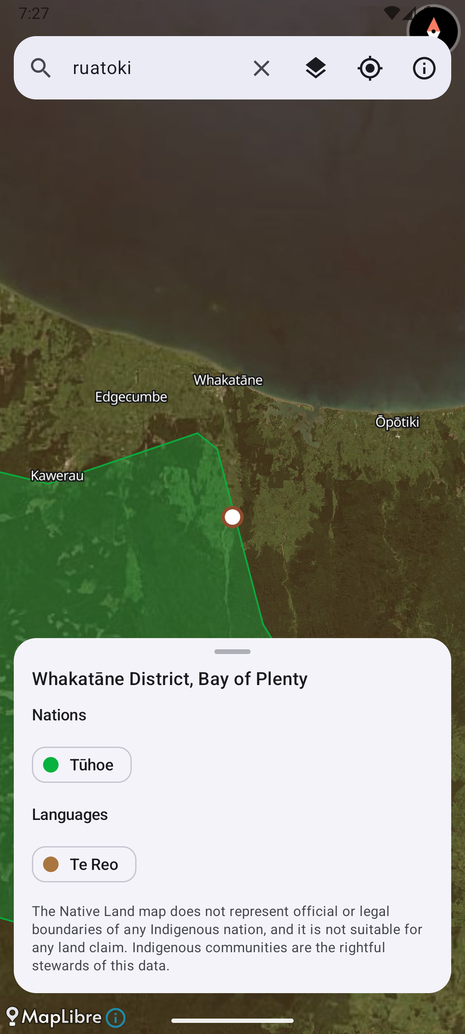 Map app showing satellite imagery near Whakatāne in Aotearoa, with a green overlay for Tūhoe Country and a pin near Ruatoki. A bottom panel titled "Whakatāne District, Bay of Plenty" lists the nation Tūhoe and language Te Reo, with the same note on boundaries.